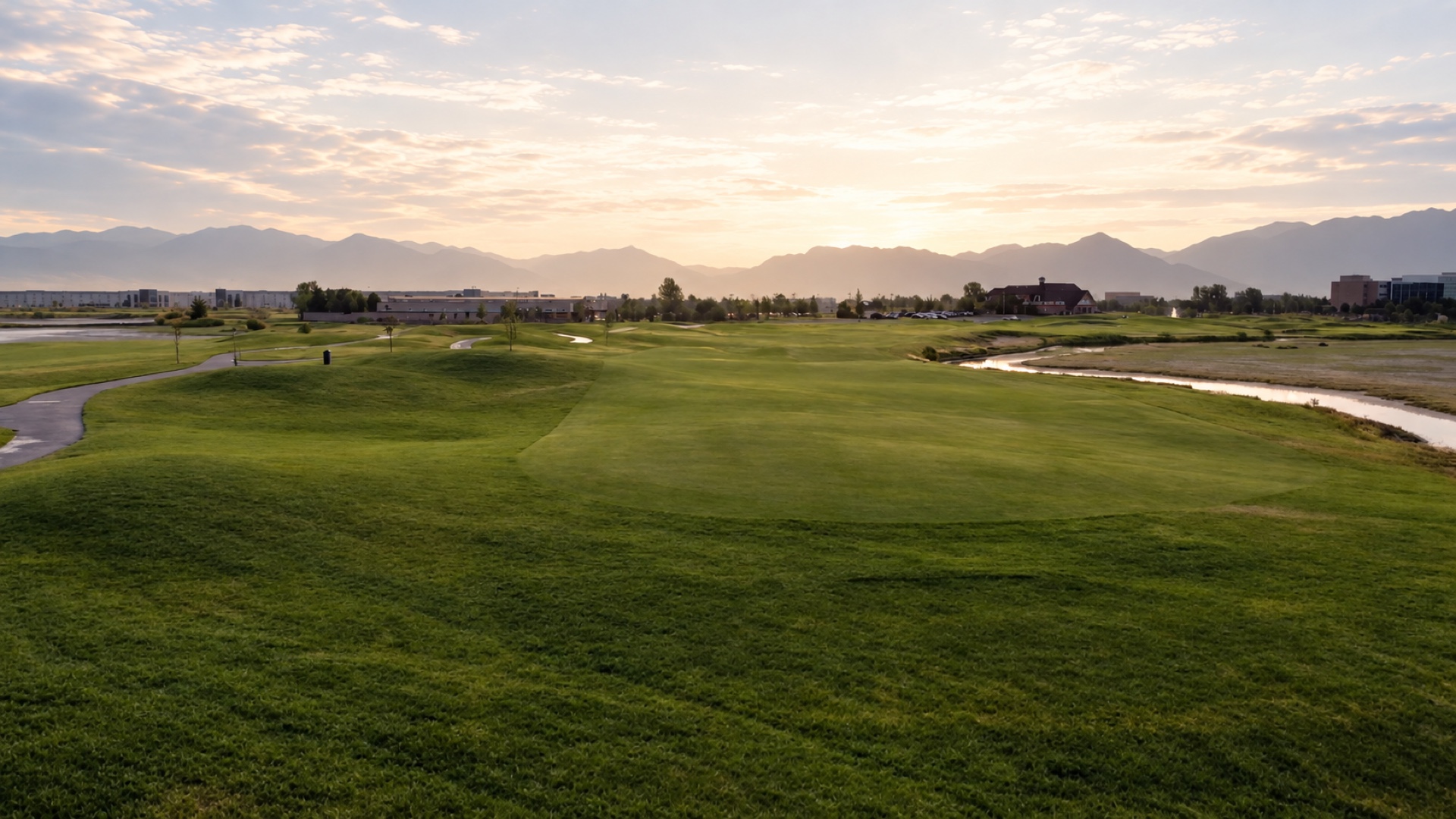 Retouched Stonebridge fairway with green turf restored across the bare foreground patch.