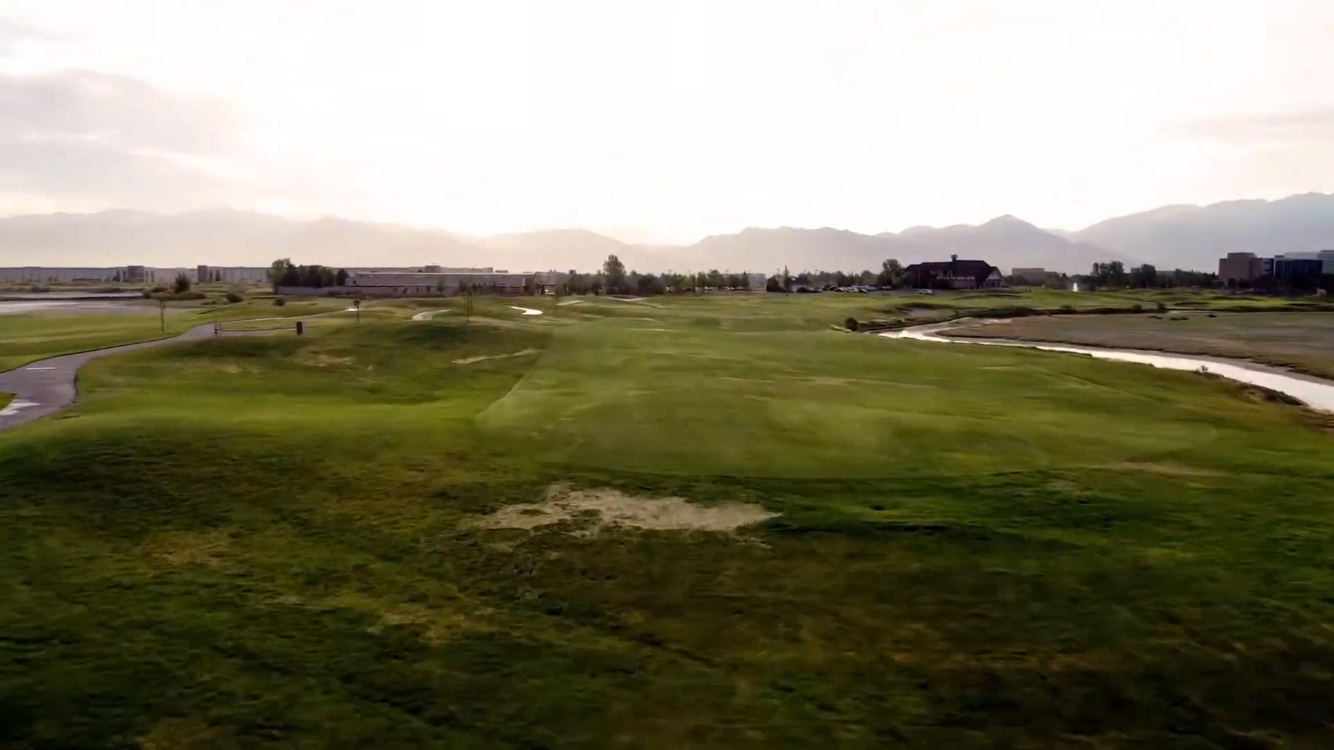 Original Stonebridge footage showing patchy turf and a large bare area in the foreground.